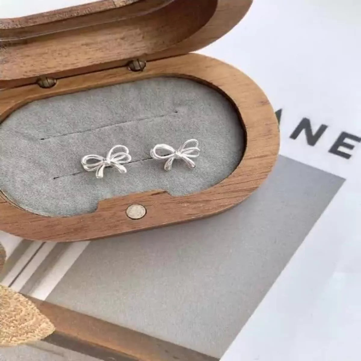 Platinum Plated Silver Bow Earrings Secondary image