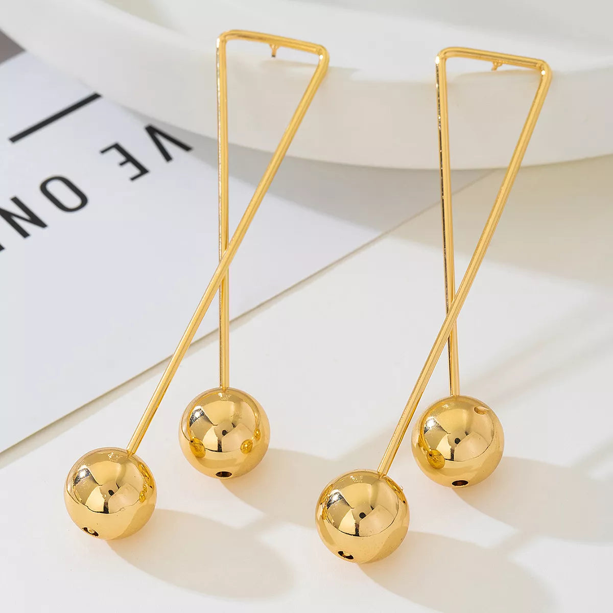 Modern Geometric Drop Earrings with Gold Balls & Triangle Design Secondary image